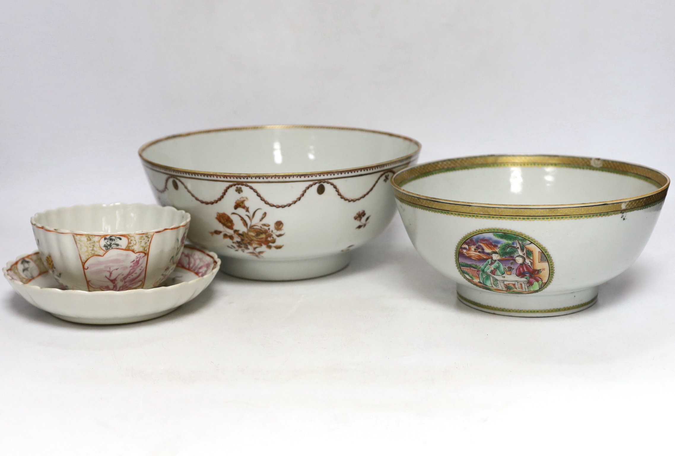 A Chinese famille rose bowl and dish and two similar bowls, all Qianlong period, largest diameter 23cm